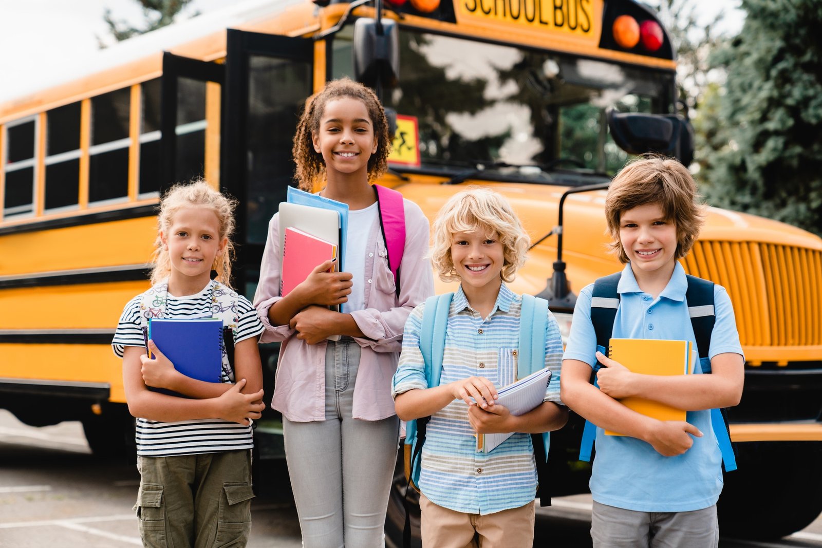 Mixed-race multiethnic school students pupils schoolchildren coming back to school after holidays